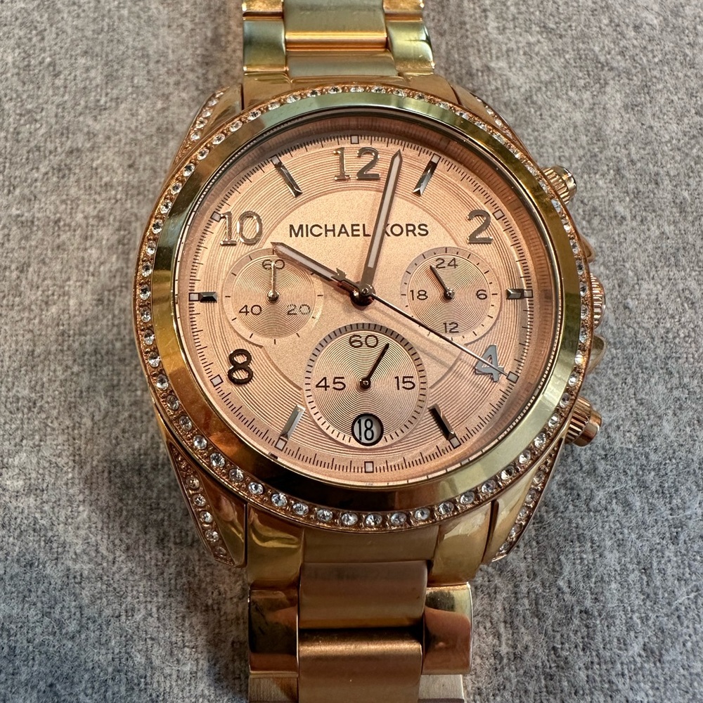 Women’s gold Michael Kors watch